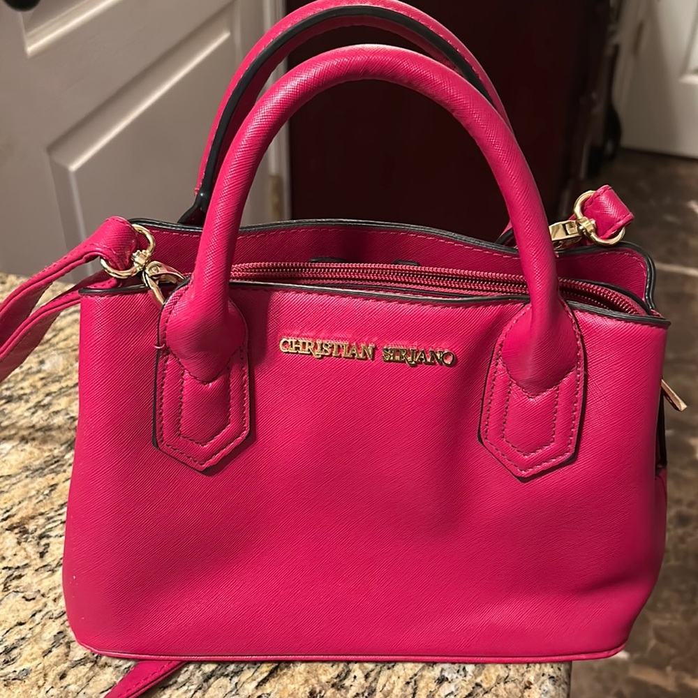 Woman’s Christian Siriano purse.